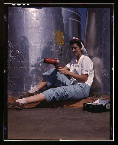Title: Girl worker at lunch also absorbing California sunshine,  Douglas Aircraft Company, Long Beach, CA License Public Domain  Photographer The Library of Congress 