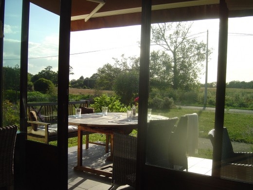 The glass front of the restaurant opens onto the terrace and Limousin countryside