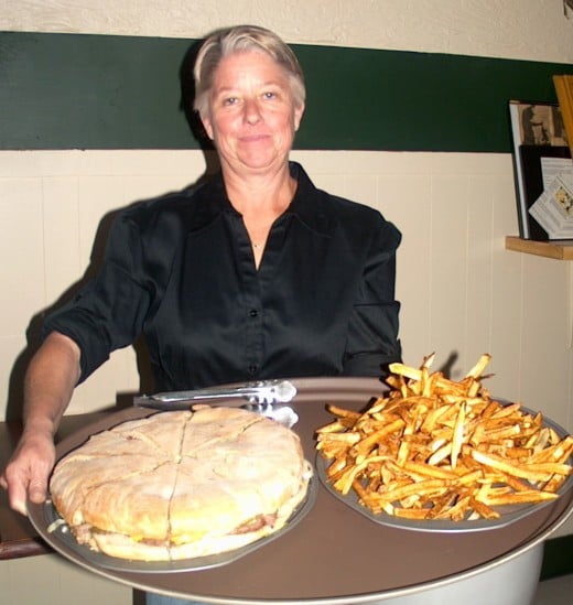 Speck's Owner Debbie Maichel with the 3-pound Speck Burger and homemade fries