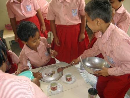 A group of kids playing in the kitchen. Image courtesy of Wikimedia.commons.org, from user Siamackz through a Creative Commons License.