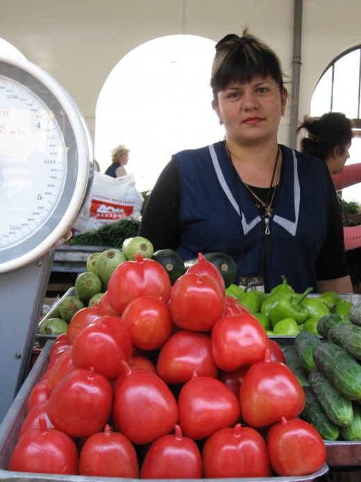 Vendor selling her goods. The vegetables look so fresh.
