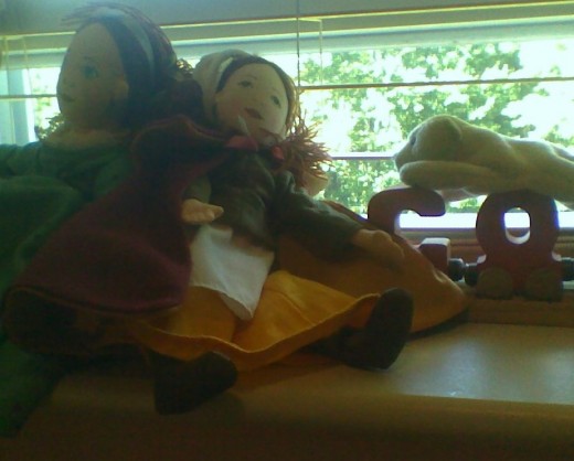 Windowsill with dolls and train