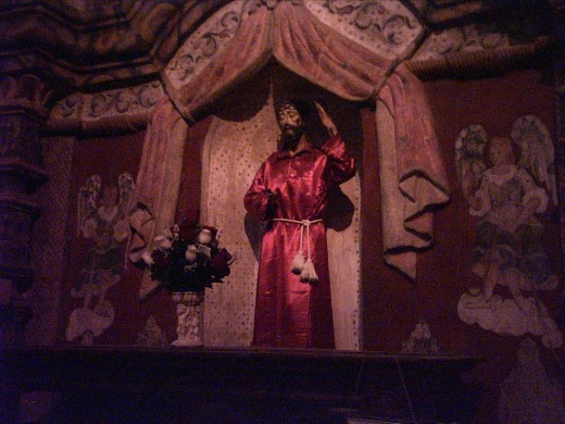 Statute of Suffering Christ in Alcove of the Eighteenth Century Mission Church of San Xavier del Bac in Tucson, AZ
