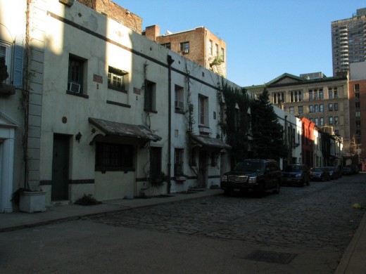 Younger houses on the south side of the alley built 1930s 