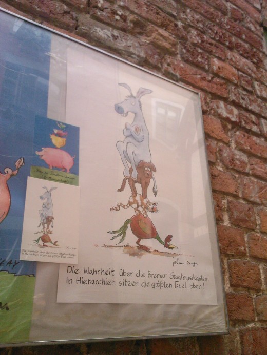 Another reference to the Bremen street musicians. The title reads "The truth about the Bremen street musicians: the big donkey is on top in the hierarchy."