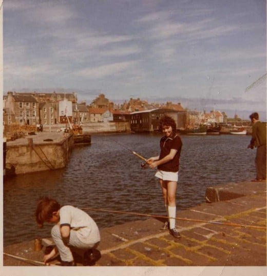 Fishing from the harbour of St Monans with the boatshed in the background