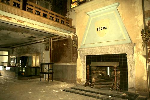 This is a before shot of the lobby, showing the mezzanine(top left) and the fireplace