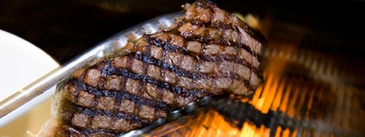 Steak Grilling over open flame at Plaza III