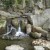 A waterfall tucked back in the pine forest.