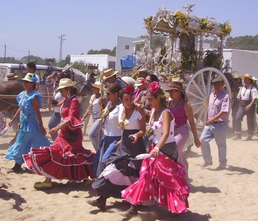 The Spanish women dress up in their colorful flamenco dresses