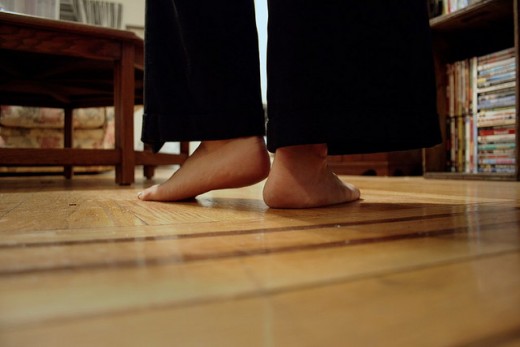 Cushioned kitchen mats making standing on a hard floor all day easier.  Photo courtesy of http://www.flickr.com/photos/caitlinator/3655198893/ under Creative Commons Attribution License