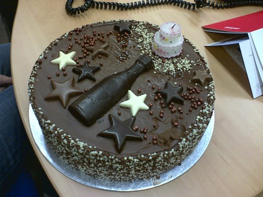 Cool Cake Idea for a Male Coworker Who Likes Chocolate.  Photo of coworker birthday cake courtesy of blackplastic at http://www.flickr.com/photos/caitlinator/3655198893/ under Creative Commons Attribution License