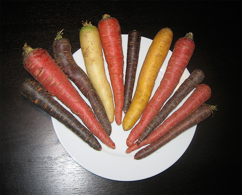 This photo isn't changed in any way. Carrots really do come in a range of colors including red, white, yellow, purple and orange.