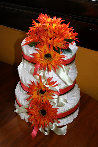 A diaper cake is one popular and highly useful gift for a baby shower.