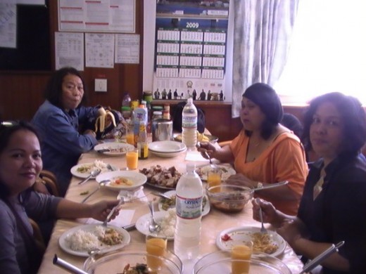 Filipina friends, dining onboard ship (IAA)