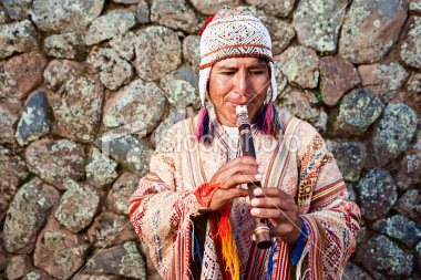 This flute player is dressed in contemporary Inca dress.