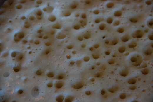 The batter around the bubbles is more solid-looking.  Flip away!