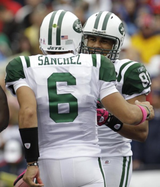 New York Jets' Dustin Keller (81) celebrates his touchdown catch with quarterback Mark Sanchez during the second half of the NFL football game against the Buffalo Bills in Orchard Park, N.Y., Sunday, Oct. 3, 2010. The Jets won 38-14. (AP Photo/ David