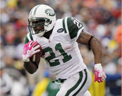 New York Jets running back LaDainian Tomlison (21) runs the ball against the Buffalo Bills during the second half of an NFL football game in Orchard Park, N.Y., Sunday, Oct. 3, 2010. The Jets won, 38-14. (AP Photo/Mike Groll)