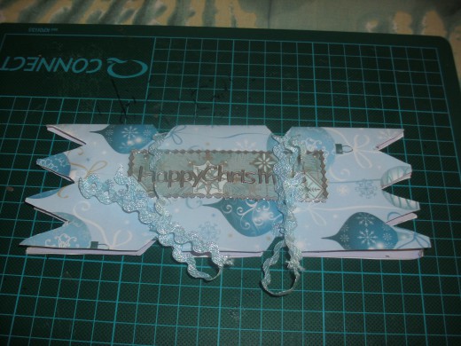 attach the sticker and tie the card with lace, or cord or anything that adds a little glitz