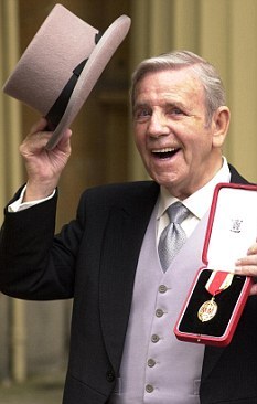 Sir Norman Wisdom recieving his knighthood from the Queen