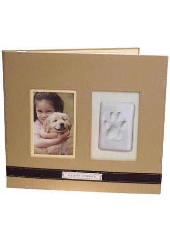 The perfect scrapbook to hold your pet's pictures and memories. Made of stitched faux leather with a ribbon accent and brushed metal name plate, scrapbook is post-bound and expandable. The cover holds a photo, your pet's paw print impression and a ke