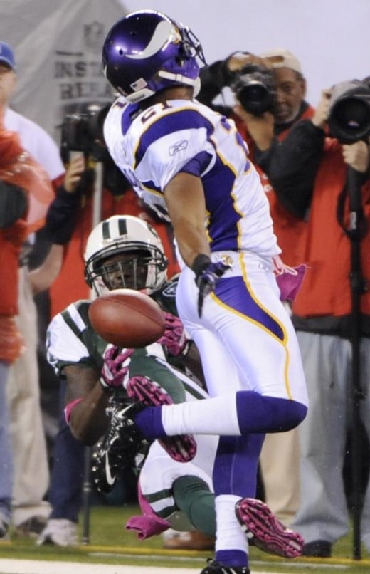     *      New York Jets' Santonio Holmes, left, fails to catch a pass while covered by Minnesota Vikings' Asher Allen during the second quarter of an NFL football game Monday, Oct. 11, 2010, in East Rutherford, N.J. (AP Photo/Bill Kostroun)       