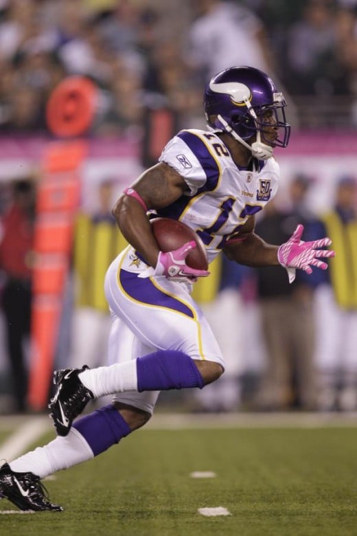     *      Minnesota Vikings wide receiver Percy Harvin (12) returns a kickoff during the first quarter of an NFL football game between the Minnesota Vikings and the New York Jets Monday, Oct. 11, 2010, in East Rutherford, N.J. (AP Photo/Kathy Will)