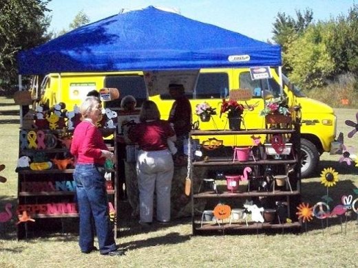 One of the busy vendors at the Monarch Festival had all kinds of yard décor, plants, butterfly related items.