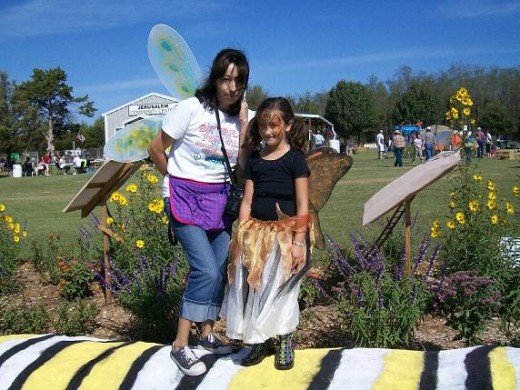 Happiness is being butterflies together and getting to pose on a caterpillar - especially at the wonderful Monarch Migration Celebration!