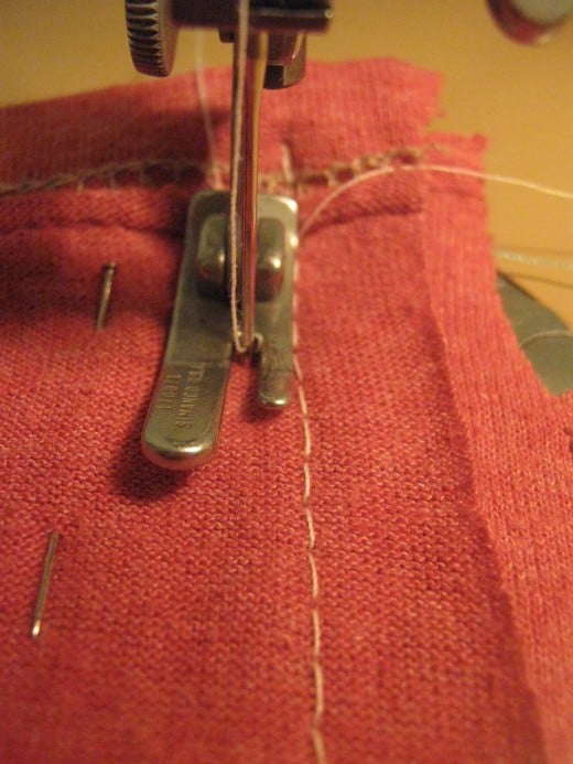 Line your first seam up against your presser foot and just follow the stitches down.  We do this so that if one seam opens up there is another one.  Do this on both of the J parts.  