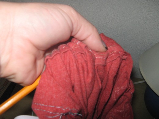 When you get close to the back seam stick your pencil through the other side, and feed it through the seam. 