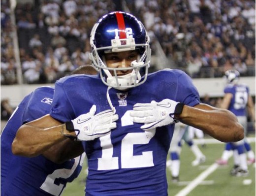 New York Giants wide receiver Steve Smith celebrates his first-half touchdwon against the Dallas Cowboys during an NFL football game Monday, Oct. 25, 2010, in Arlington, Texas. (AP Photo/Mike Fuentes)