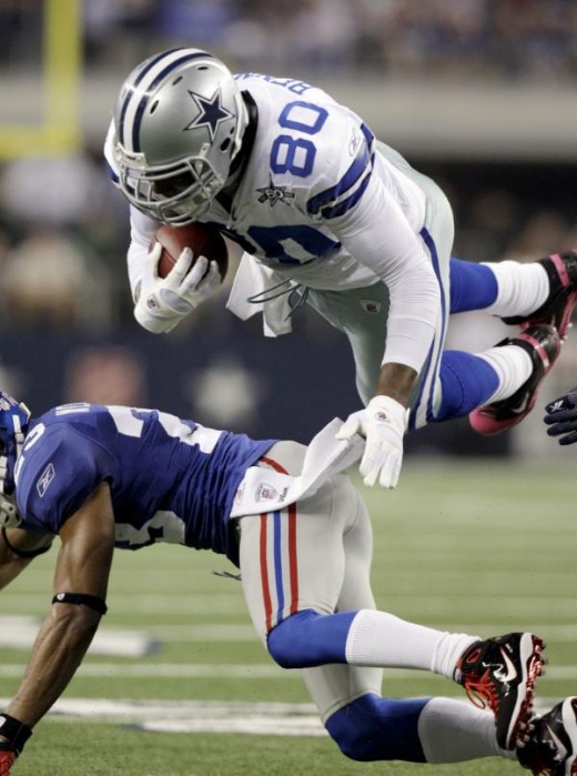 Dallas Cowboys tight end Martellus Bennett is upended by New York Giants cornerback Corey Webster during the first half of an NFL football game Monday, Oct. 25, 2010, in Arlington, Texas. (AP Photo/LM Otero)