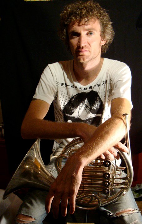 I enjoy taking portraits of musicians with their instruments.