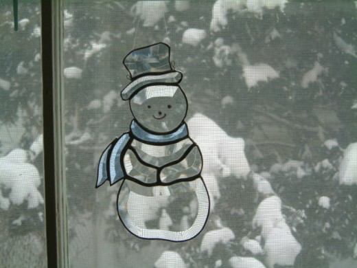 Snowman made from a Kit  which was very easy to do.  Just had to foil and solder  the glass together.
