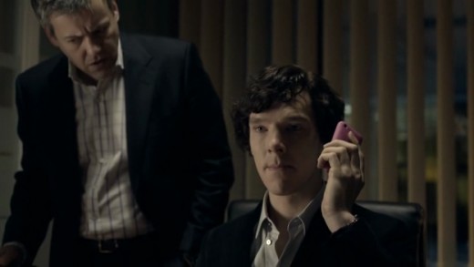 Detective Inspector Lestrade (Rupert Graves) and Sherlock at Scotland Yard.