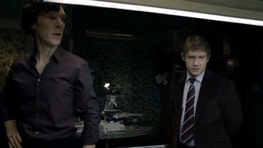 Sherlock and John at the flat, with Sherlock's home chemistry lab in the background.