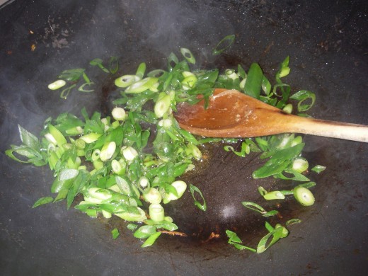 Wipe the wok clean. Heat oil in a wok over high heat. Add shallots and fry for 1 minute.