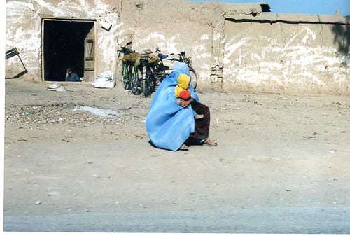 woman with baby at refugee camp outside Peshawar