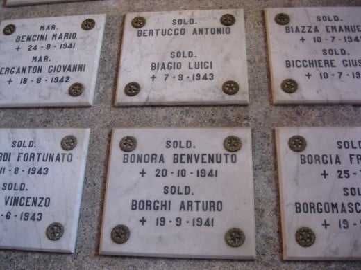 Close-up of plaques for individual World War II soldiers killed in action and entombed in the crypt