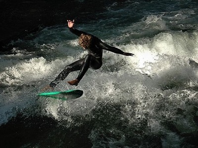 One brave man surfing on the Eisbach an offshoot of the Isar