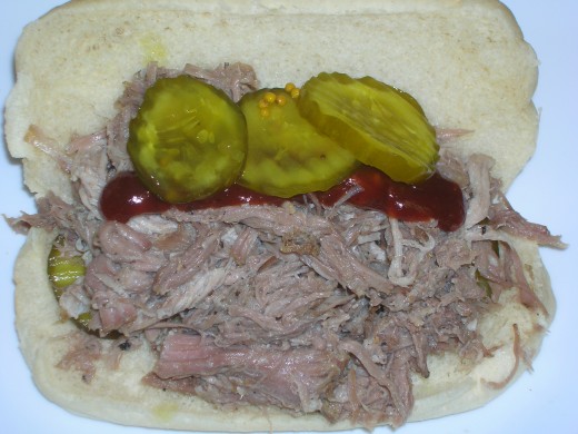 Crockpot Tender BBQ Pork Sandwich with Pickles and BBQ Sauce