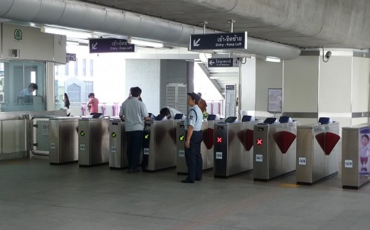 Sky Train entry and exit gates. There is usually a guard standing by to assist.