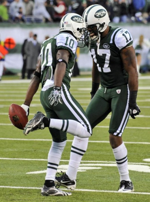 New York Jets wide receiver Santonio Holmes (10) celebrates with teammate Braylon Edwards (17) after catching a touchdown-pass during the fourth quarter of an NFL football game against the Houston Texans at New Meadowlands Stadium, Sunday, Nov. 21, 2