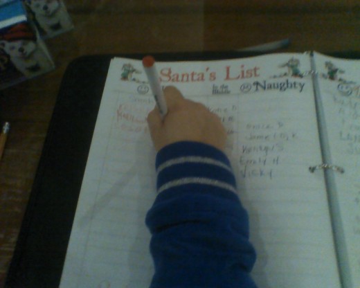 My daughter enjoyed writing her name in the list of children who have been nice this year.