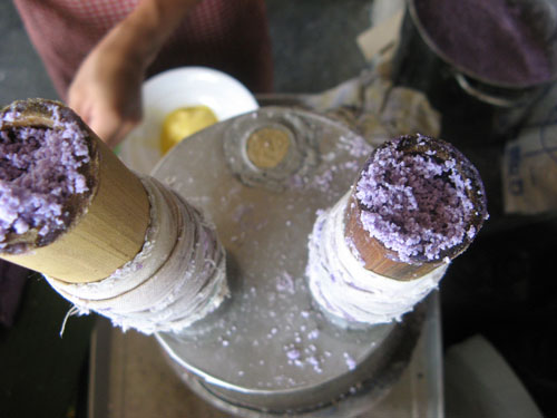 The famed Puto Bumbong (usually colored purple sticky rice cake steamed on young bamboo pole)