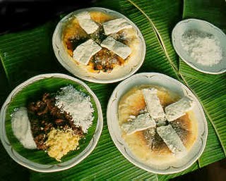 Bibingka (baked rice cake on pan ) with white chesse toppings made out of carabao's milk