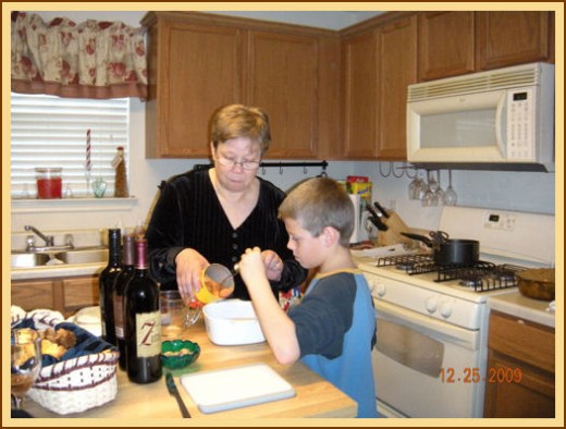 My step-great-grandson, Logan, helping his maternal grandmother, Penny, with the preparations. last time (now he's 10)