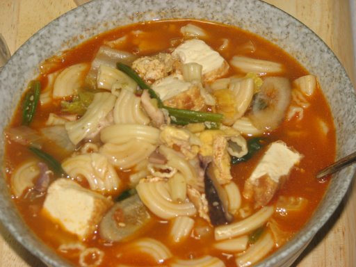 Pasta soup: pasta with tofu, mushrooms, squid, spinach, eggs, carrots, Chinese leaks